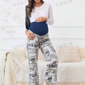 NWOT Maternity high waisted denim pants with newspaper & butterfly print